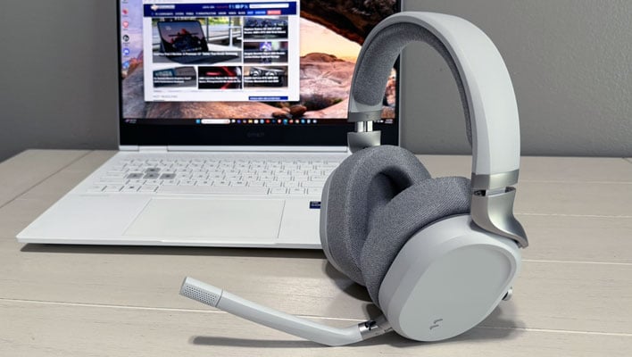Side view of Fractal Design's Scape headset on a table next to a laptop.